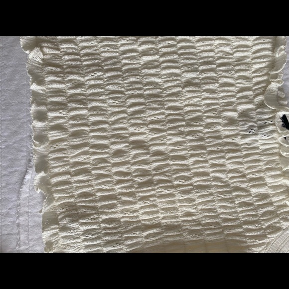 This is a white ruffled and detailed crop top - Picture 4 of 7